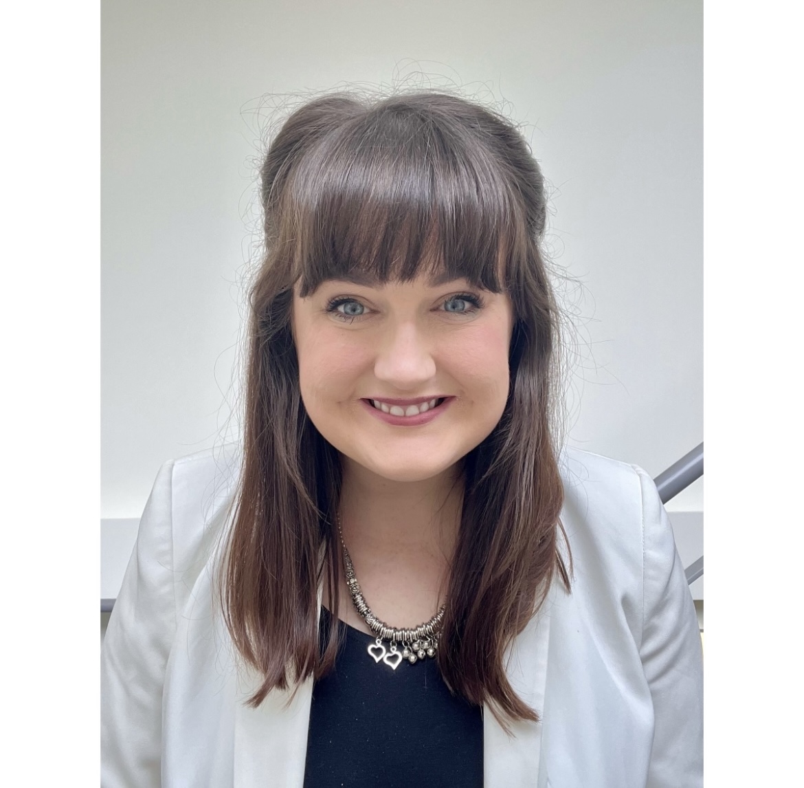 photo of smiling woman with long dark hair